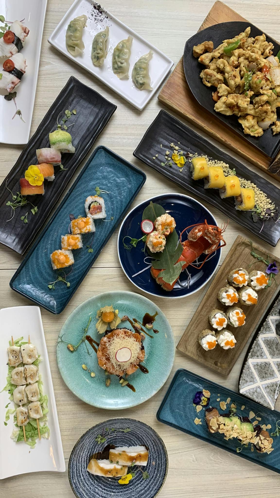 Vibrant display of various gourmet Asian dishes on elegant plates.